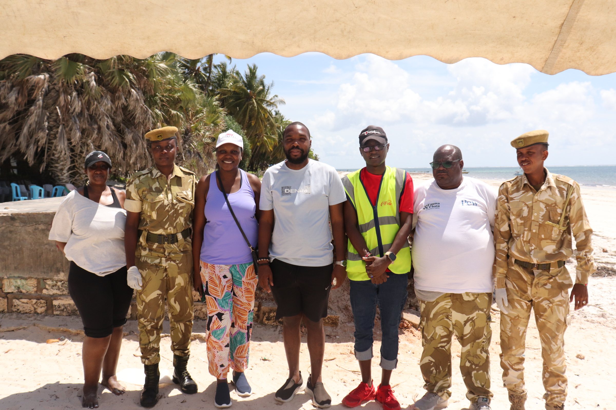 Rangers, volunteers and partners standing together on a Mombasa beach after the zero-waste coastal action